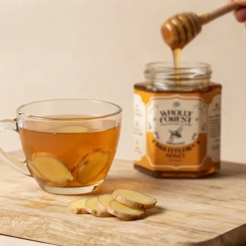 Ayurvedic immunity remedy with fresh ginger slices, whole black peppercorns, and pure raw Himalayan honey drizzle